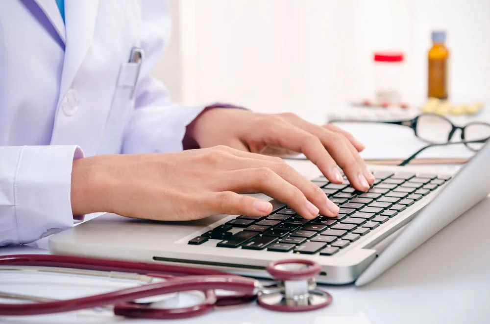 Healthcare professional using computer